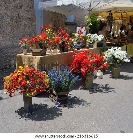 PROVENCE, FRANCE - JUL 6, 2014: Beautiful bouquets of flowers for sale on the street of the small village Ferrassieres. Street markets are very popular business in rural region of France