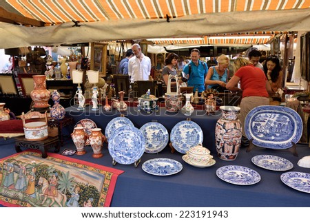 VENICE, ITALY - SEP 21, 2014: Old jewelry, accessories, toys, painting, arts, etc for sale at Venice Campo San Maurizio flea market. This flea market serves the professional antique dealers.