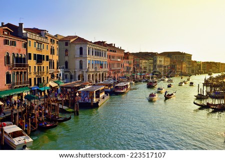 VENICE, ITALY - SEPT 25, 2014: View on the Grand Canal in Venice from Rialto bridge at sunset. The Grand Canal is the largest canal in Venice, Italy.