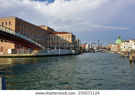 VENICE, ITALY - SEPT 22, 2014: View on the Grand Canal in Venice from the bridge of the Constitution at sunset time. The Grand Canal is the largest canal in Venice, Italy.