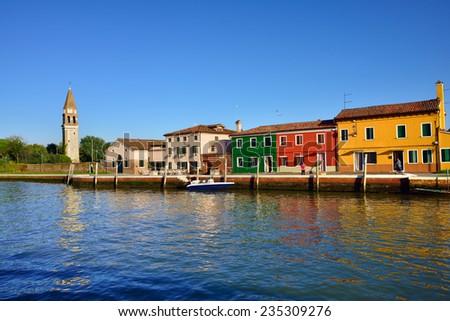 MAZZORBO, ITALY - SEPT 23, 2014 : Colorful houses on the small island Mazzorbo at sunset. Venice and the Venetian lagoon are on the UNESCO World Heritage List