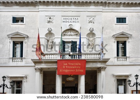 VENICE, ITALY - SEP 25, 2014: Poster of opera La Traviata on facade the theater in Venice - Teatro La Fenice di Venezia. Founded in 1774  La Fenice became the site of many famous operatic premieres