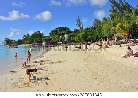 MAURITIUS - MAY 3, 2013: Pereybere public beach.  It is popular place with shopping facilities, restaurants and pubs. This is one of the best beaches for swimming