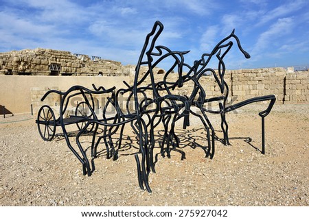 CAESAREA, ISRAEL - APR 6, 2015: Modern installation - an ancient horse carriage shown in Caesarea Maritima National Park
