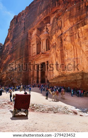 PETRA, JORDAN - APR 1, 2015: Tourists visit the  Petra. UNESCO world heritage site and one of The New 7 Wonders of the World.