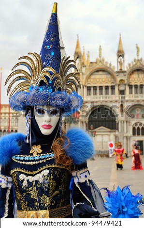 VENICE - MARCH 7: An unidentified masked person in costume in St. Mark's Square during the Carnival of Venice on March 7, 2011. The 2011 carnival was held from February 26th to March 8th