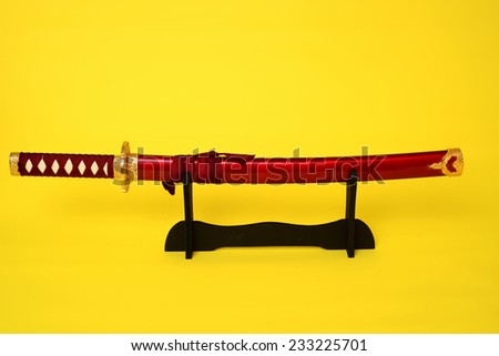 Samurai sword, Katana, Wakizashi and Tanto, isolated on yellow background