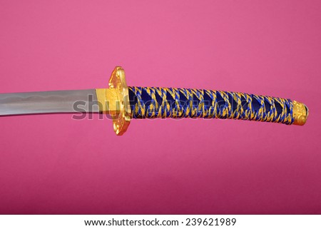 Samurai sword, Katana, Wakizashi and Tanto, isolated on pink background