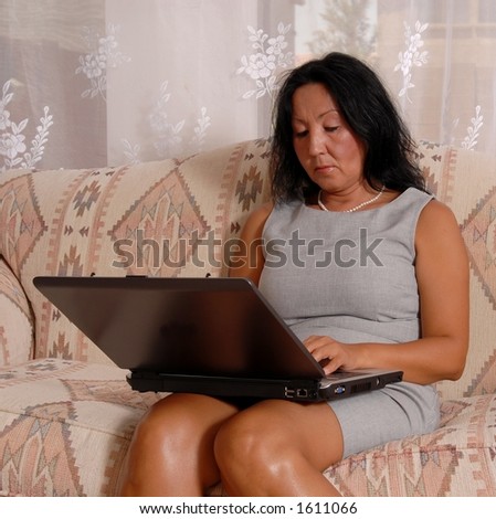 Business lady working on laptop at home
