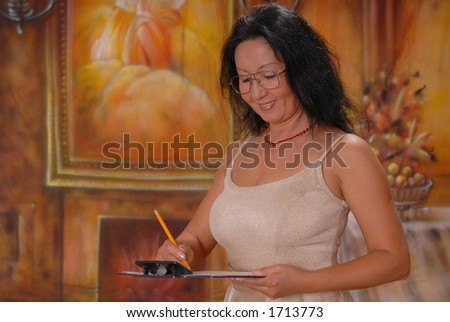 Beautiful lady in a warm setting taking notes on a clipboard