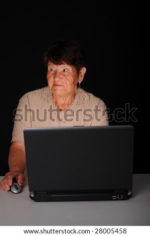 Senior citizen woman working on a laptop computer