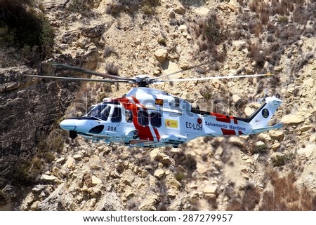 ALICANTE COAST, SPAIN - JUNE 14: Helicopter of the Spanish  Maritime Rescue Team finding injured over Cabo La Nao beach, on june 14, 2015 in Alicante coast.