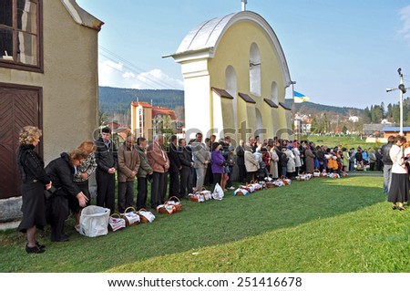 SKHIDNYTSIA, UKRAINE-APRIL 24: Easter, parishioners of the Orthodox Church with  Easter basket with food. Easter Celebration in the Orthodox Church Cathedral on April 24, 2011, Skhidnytsia, Ukraine