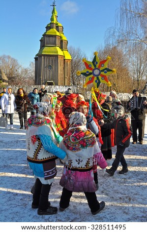 KIEV, UKRAINE - JANUARY 7: Folk Ukrainian Group celebrating Christmas Day in the orthodox churches.  Museum of Ukrainian Folk Architecture and Rural Life PYROGOVO, on January 7, 2015 Kiev, Ukraine