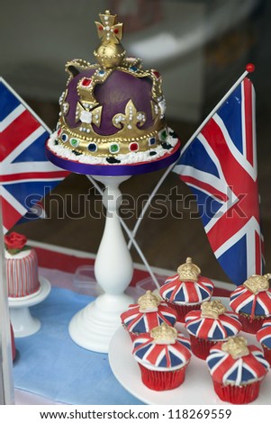 SADDLEWORTH, GREAT BRITAIN - JUNE 1:  Festive cakes in a small cake shop window display to celebrate Queen's Diamond Jubilee in Saddleworth village, UK  on June 1, 2012.