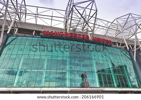 MANCHESTER, ENGLAND - JULY 6, 2014: Old Trafford stadium is home to Manchester United one of the wealthiest and most widely supported football teams in the world.