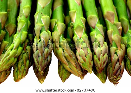 Fresh green asparagus tips isolated on white