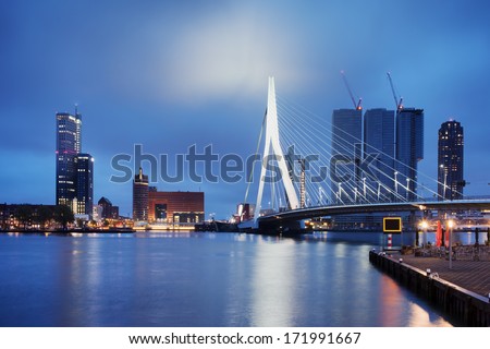 City of Rotterdam downtown skyline by the river at night in South Holland, the Netherlands.