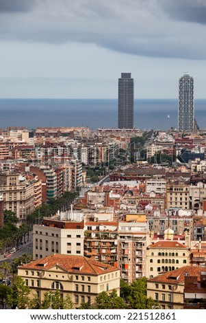 View from above over city of Barcelona in Catalonia, Spain. Carrer de la Marina street leading to the Mediterranean Sea.