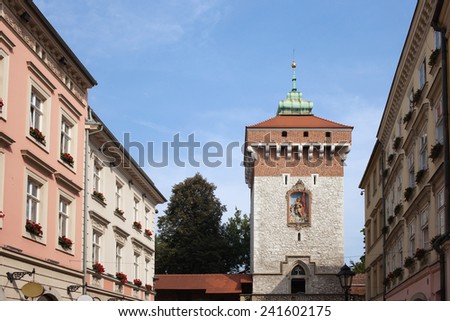 Florianska Gate (St. Florian\'s Gate) and old tenement houses on Florianska street in the Old Town of Krakow in Poland.