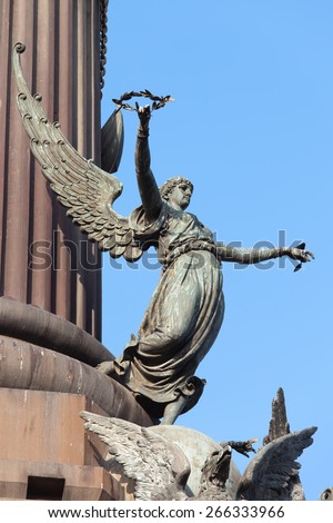 Sculpture of Pheme (Greek mythology) or Fama (Roman mythology) part of Columbus Monument in Barcelona, Catalonia, Spain.