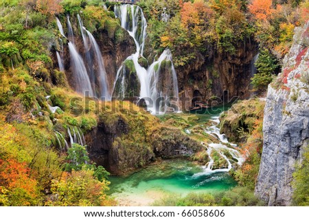 Scenic waterfalls in a beautiful picturesque autumn scenery of the Plitvice Lakes National Park in Croatia