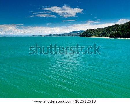 Turquoise waters of Cook Strait off Abel Tasman National Park, South Island, New Zealand