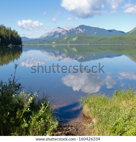 Beautiful Rock Lake  Alberta  Canada  calm surface mirrors Willmore Wilderness Park mountain nature habitat landscape
