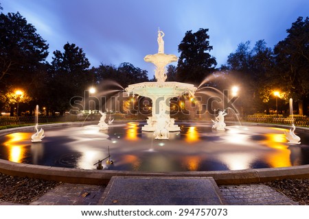 Forsyth Park Fountain famous landmark at night in Historic District of City of Savannah, Georgia, USA
