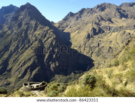 View of Runkuracay Ruins with Andes Moutain Range on the Inca Trail hike to Machu Picchu sacred Incan City
