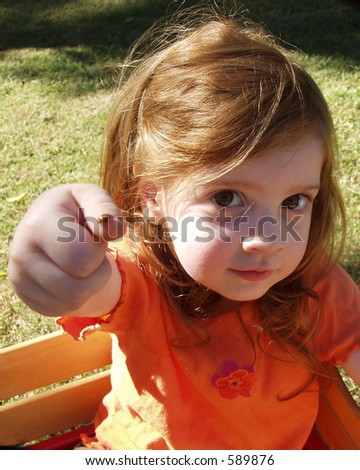 little girl with lady bug on hand