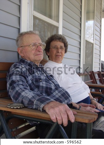 old couple relaxing on their porch