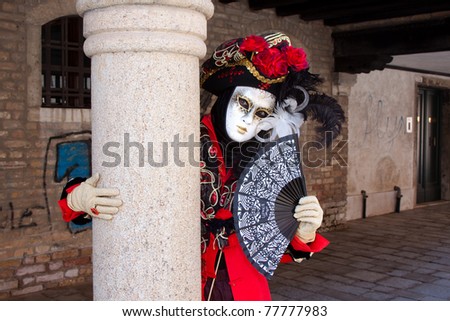 VENICE, ITALY - MARCH: Participant with a mask on in St. Mark's Square, Carnival of Venice on March, 2011 in Venice, Italy. The carnival was held from February 26 to March 8, 2011.