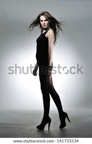 Full body sexy woman in black evening dress,