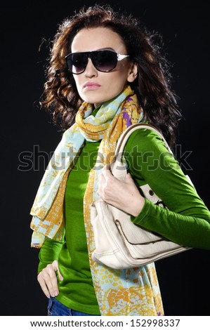 Portrait of fashion girl in comfort scarf with bag