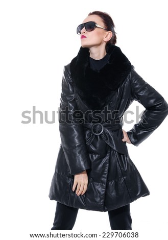 fashion model in black coat clothes wearing sunglasses posing