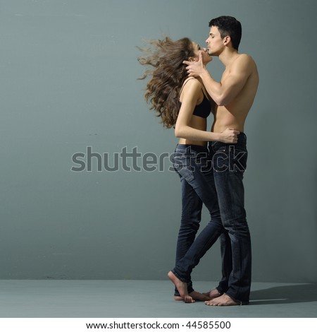 Sexy young couple wearing jeans in love
