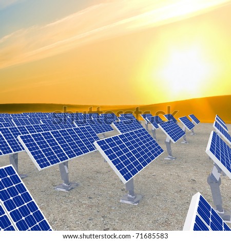 many solar energy panels against sunrise.