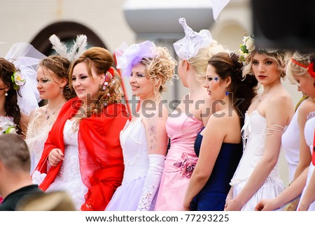 DONETSK, UKRAINE - MAY 15: Annual wedding parade. Bride parade participants in wedding gowns poses during the 