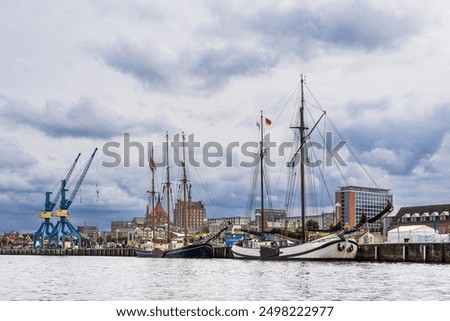 Similar – Image, Stock Photo View over the Warnow river to the city of Rostock in the evening