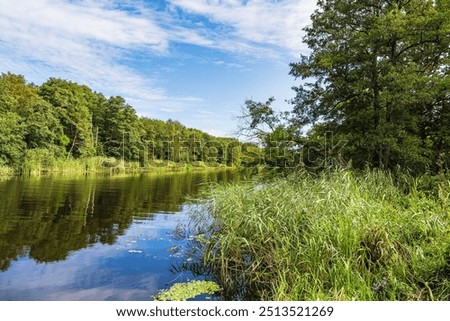 Similar – Image, Stock Photo View over the Warnow river to the city of Rostock in the evening