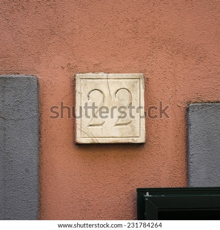 House number twenty two carved in natural stone