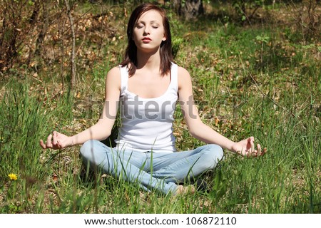 Young Woman During Relaxation And Meditation In Park Meditation Session ...