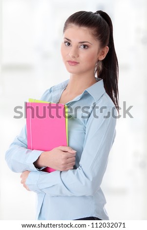 Happy student woman with notebook