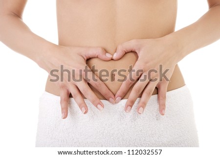 Hand on fit slim woman belly, isolated on white background