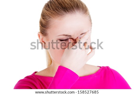 Young woman with sinus pressure pain , isolated on white