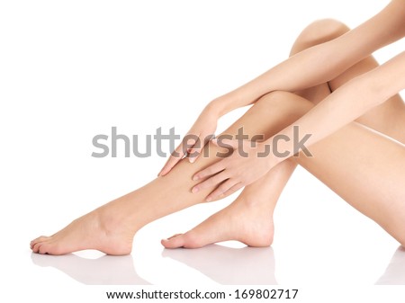 Beautiful smooth and shaved legs. Isolated on white.