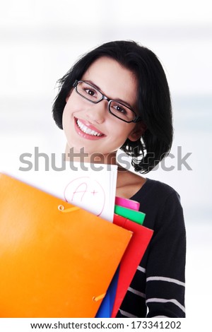 Student woman showing her perfect A+ exam result . Isolated on white