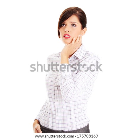 Young worried business woman , isolated on white background