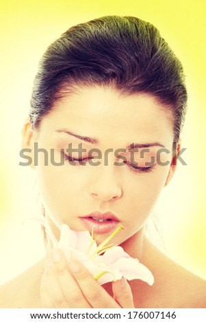 Portrait of the attractive girl without a make-up, over green background